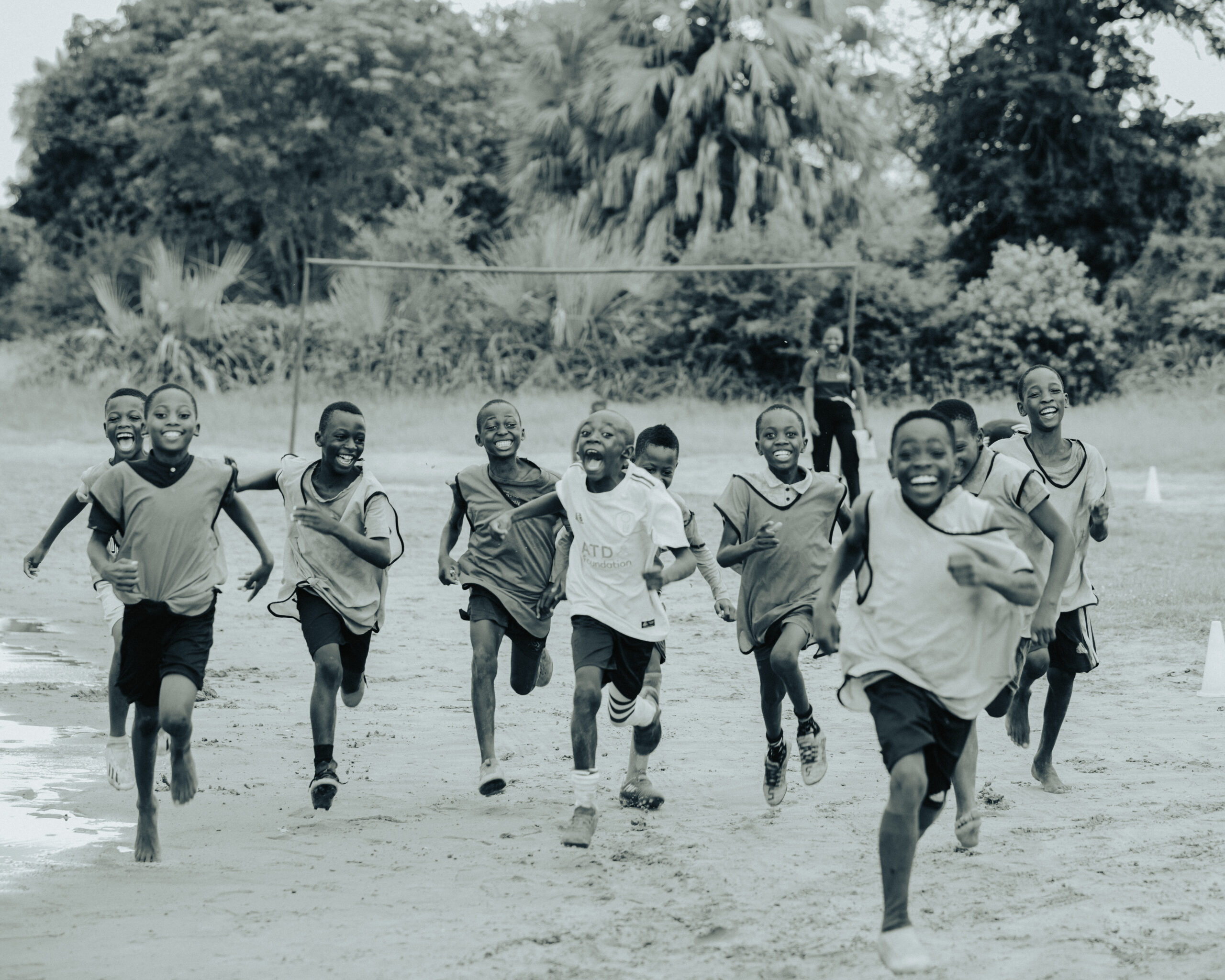 A photograph of a group of Zambian boys running.