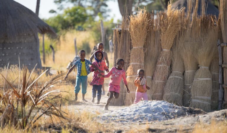 Zambian children running in their village.