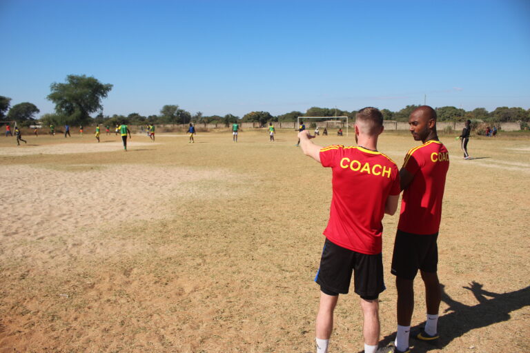 Two volunteer international coaches in Zambia.